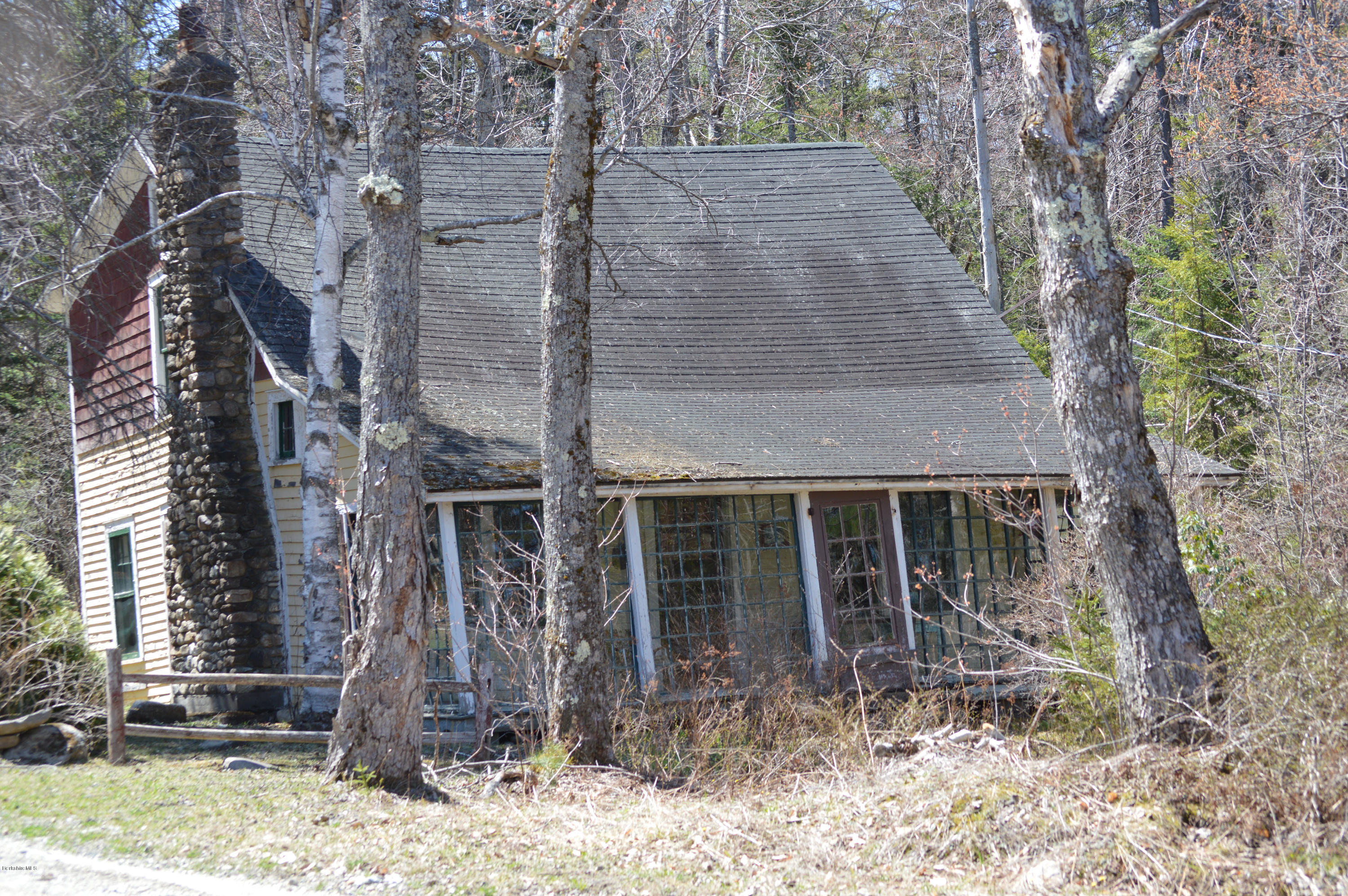 995 Plumb Road Becket, MA 01223 - Photo 8 of 12 a front view of a house with garden