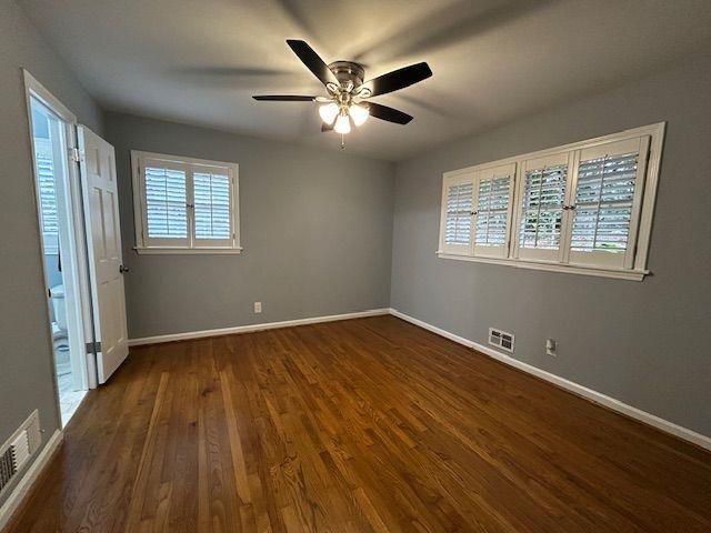 2744 Hunting Hill Lane Decatur, GA 30033 - Photo 11 of 16 a view of an empty room with wooden floor and a window