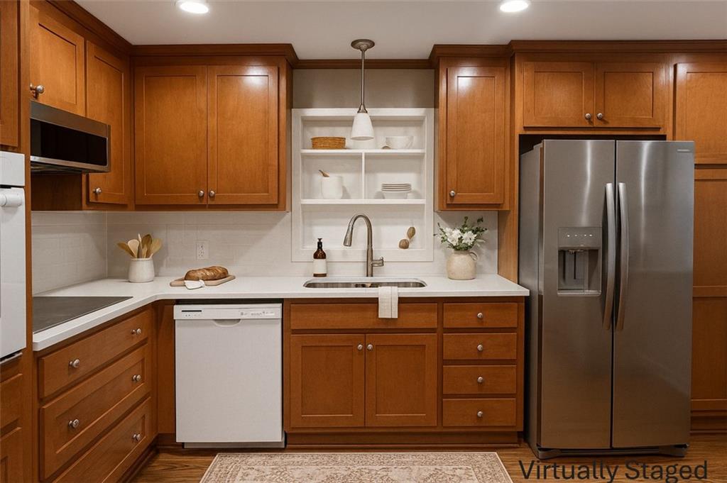 2744 Hunting Hill Lane Decatur, GA 30033 - Photo 3 of 16 a kitchen with a sink a refrigerator and cabinets