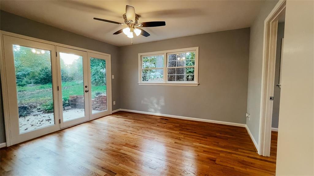 2744 Hunting Hill Lane Decatur, GA 30033 - Photo 6 of 16 a view of an empty room with wooden floor and a window