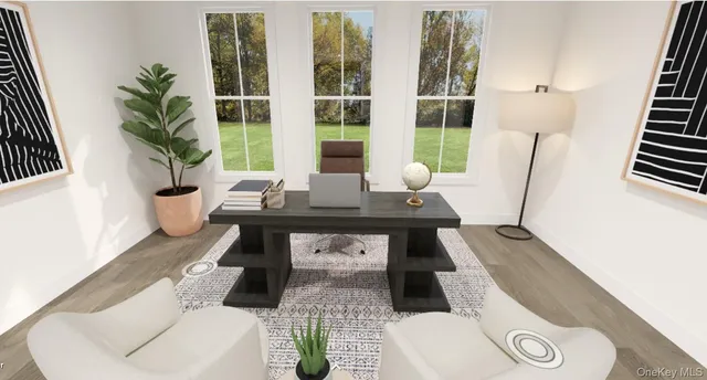 a living room with furniture and a potted plant