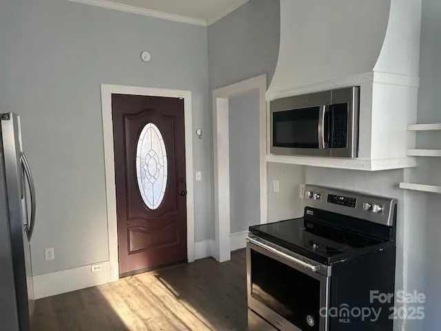 a kitchen with a stove and a microwave