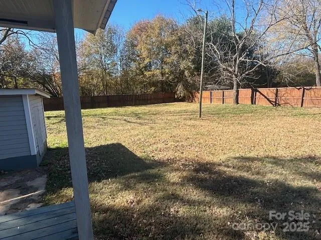 a view of a yard with trees