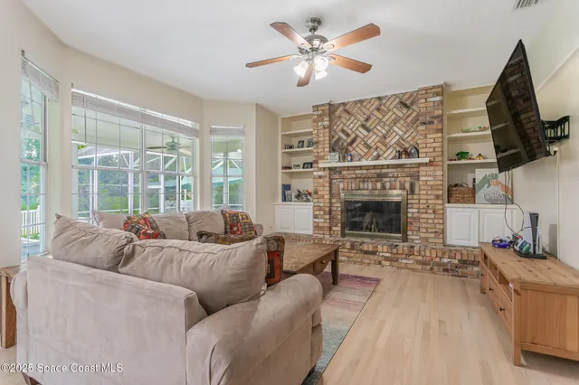 a spacious bedroom with a bed a table and painting