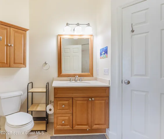 a utility room with cabinets washer and dryer