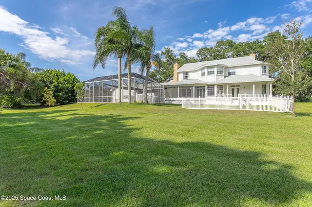 a view of a lake with a yard