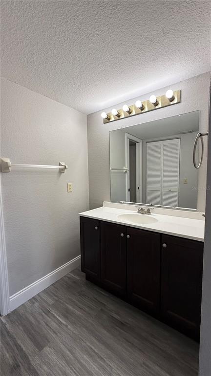 175 Kings Highway, Unit 1126 Punta Gorda, FL 33983 - Photo 11 of 17 a bathroom with a sink and mirror