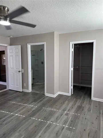 a bathroom with a shower toilet and sink