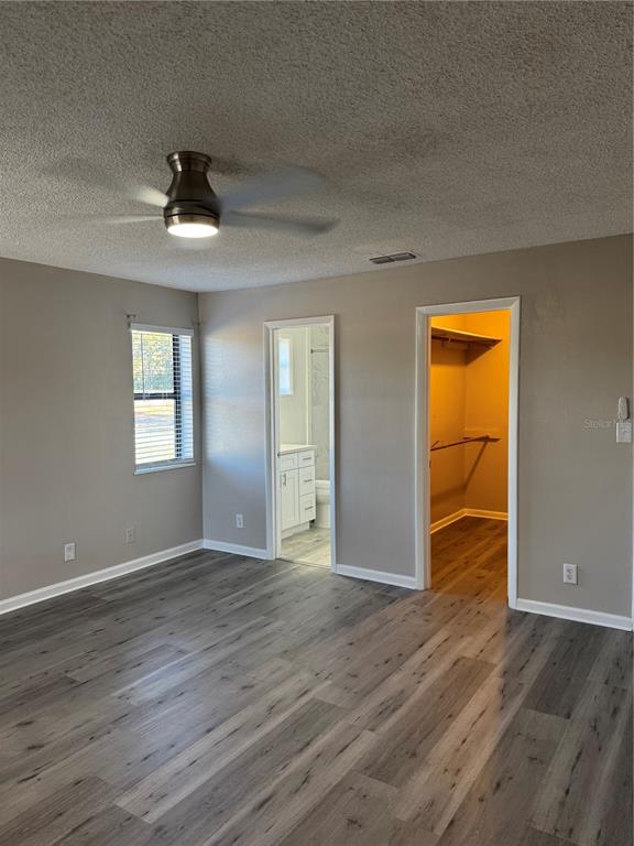 4550 Ewell Road Lakeland, FL 33811 - Photo 28 of 49 a view of an empty room with wooden floor and a window
