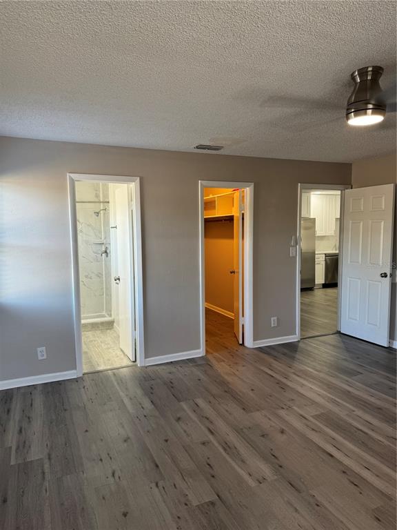 4550 Ewell Road Lakeland, FL 33811 - Photo 29 of 49 an empty room with wooden floor and closet