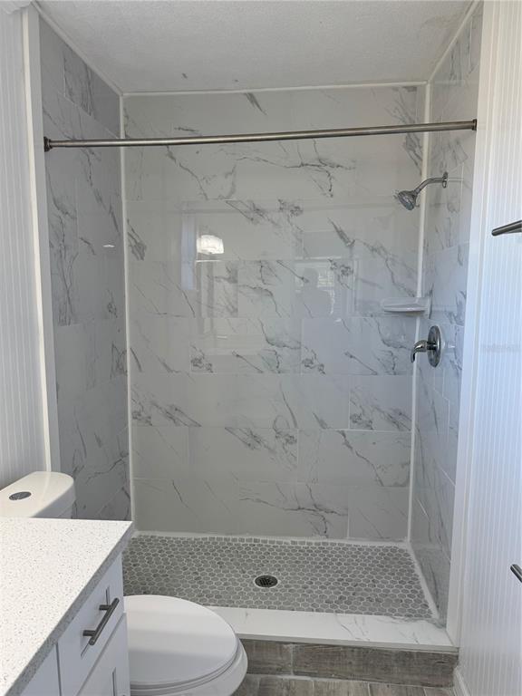 4550 Ewell Road Lakeland, FL 33811 - Photo 31 of 49 a bathroom with a shower and a toilet