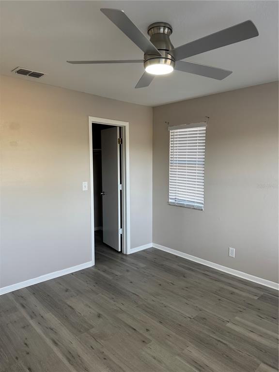 4550 Ewell Road Lakeland, FL 33811 - Photo 35 of 49 a view of an empty room with wooden floor
