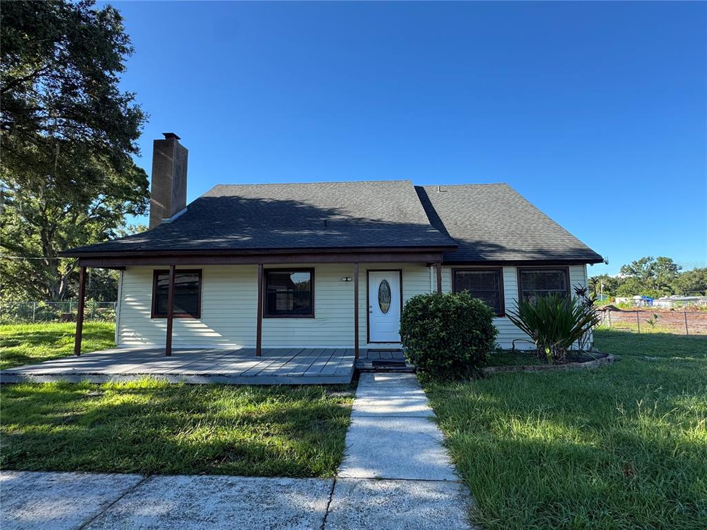 4550 Ewell Road Lakeland, FL 33811 - Photo 42 of 49 a front view of a house with a yard