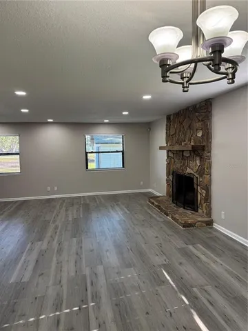 a view of a kitchen cabinets and wooden floor