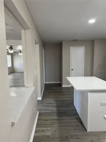 a kitchen with stainless steel appliances a refrigerator sink and cabinets