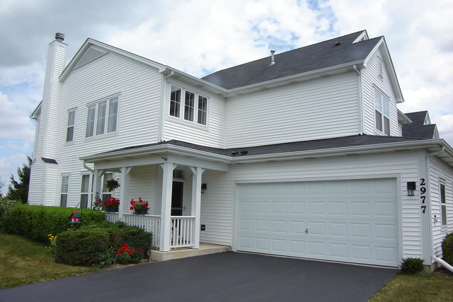 2977 Falling Waters Lane, Unit 2977 Lindenhurst, IL 60046 - Photo 1 of 25 front view of a house with a garden