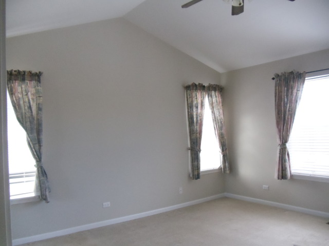 2977 Falling Waters Lane, Unit 2977 Lindenhurst, IL 60046 - Photo 14 of 25 an empty room with windows