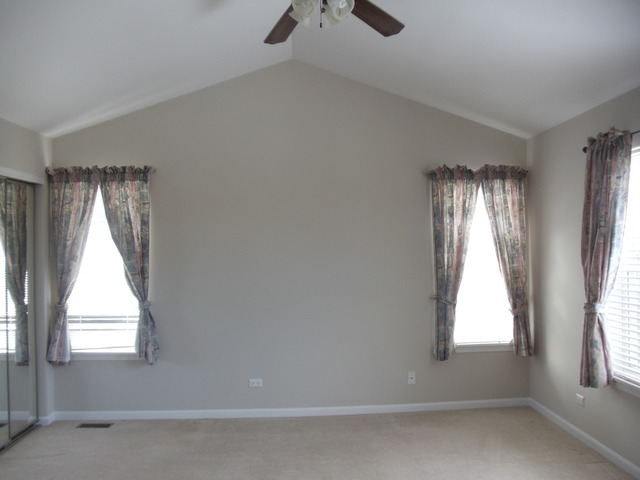 2977 Falling Waters Lane, Unit 2977 Lindenhurst, IL 60046 - Photo 15 of 25 an empty room with windows and closet