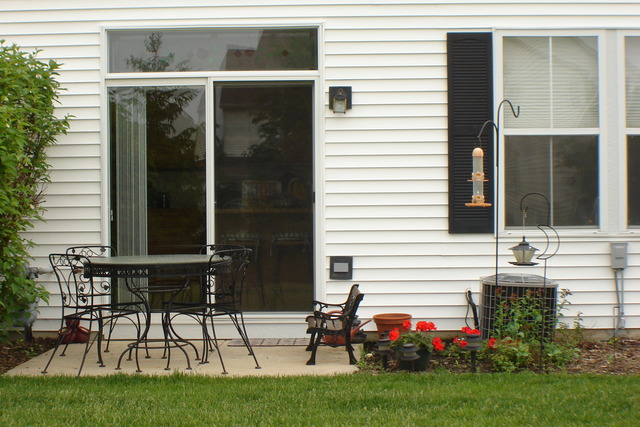 2977 Falling Waters Lane, Unit 2977 Lindenhurst, IL 60046 - Photo 21 of 25 a view of two chairs in front of house
