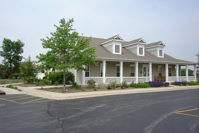 2977 Falling Waters Lane, Unit 2977 Lindenhurst, IL 60046 - Photo 23 of 25 a front view of a building with street view