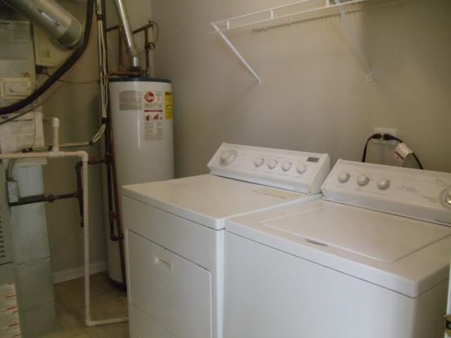 2977 Falling Waters Lane, Unit 2977 Lindenhurst, IL 60046 - Photo 10 of 25 a utility room with dryer and washer