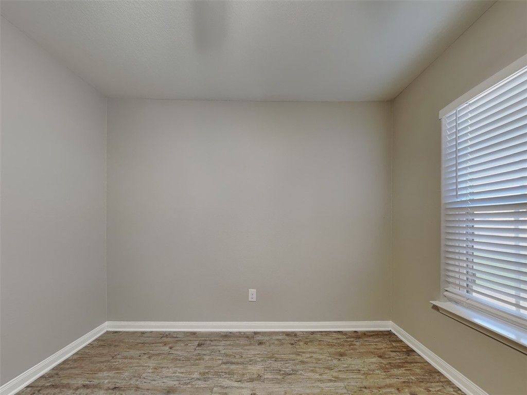 1525 Treeta Trail Kyle, TX 78640 - Photo 11 of 16 a view of an empty room with a window