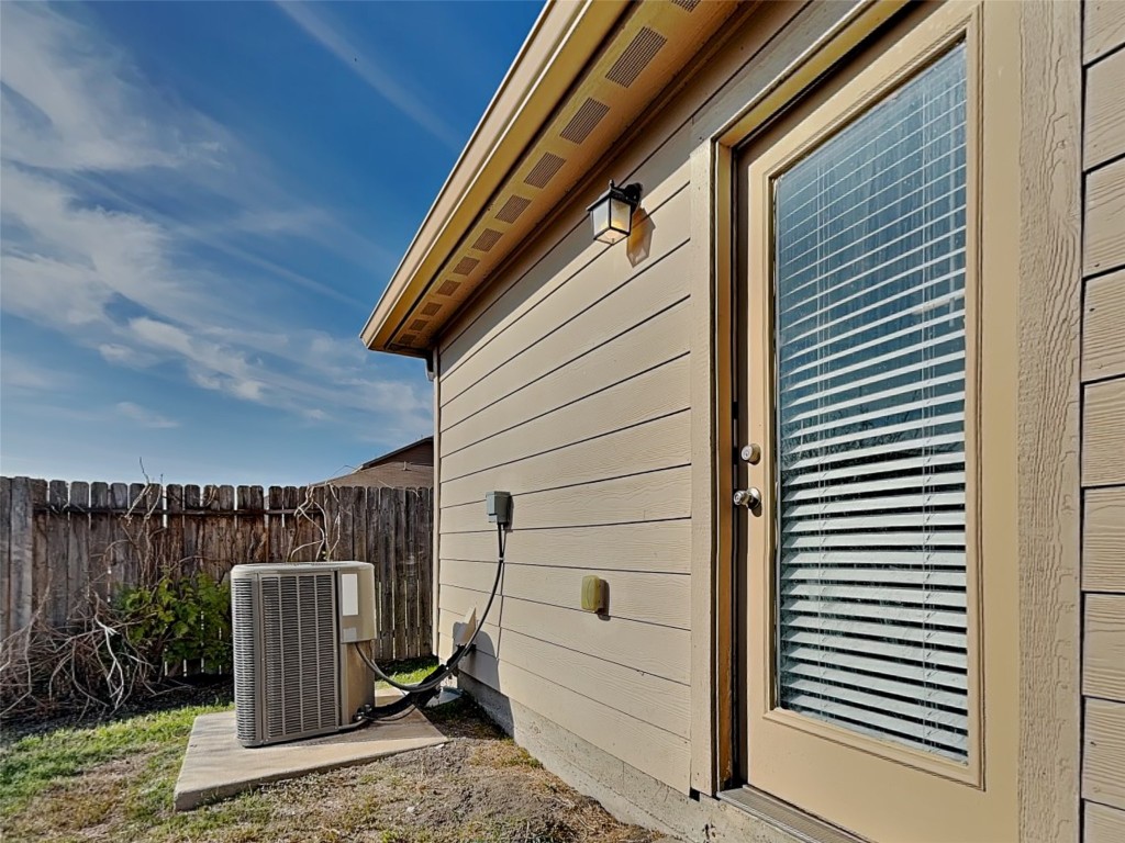 1525 Treeta Trail Kyle, TX 78640 - Photo 14 of 16 a view of a door and a chair