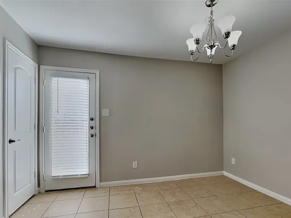 an empty room with a chandelier
