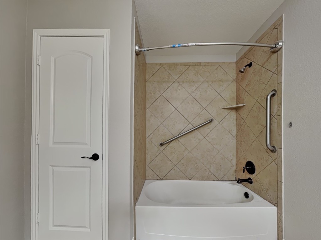 1525 Treeta Trail Kyle, TX 78640 - Photo 9 of 16 a bathroom with a bathtub