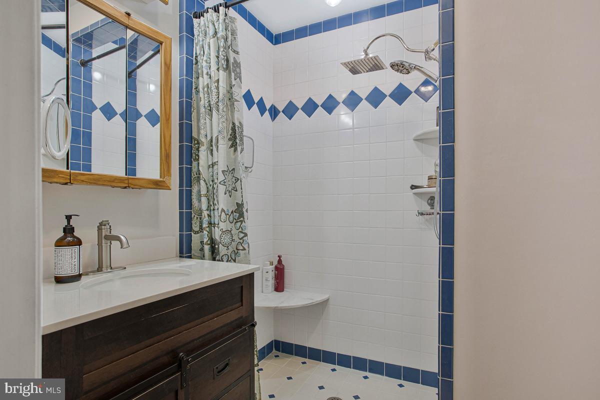 6600 Ashland Road La Plata, MD 20646 - Photo 20 of 40 a bathroom with a sink and a mirror