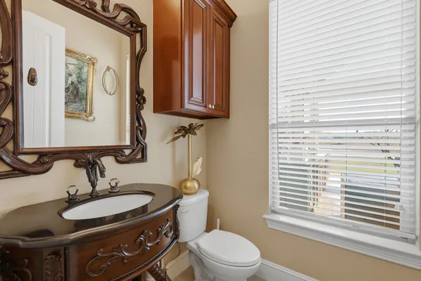 a bedroom with furniture and a large window