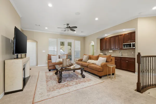 a living room with furniture and a flat screen tv