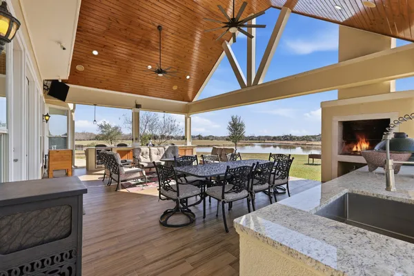 a view of a patio with a table and chairs