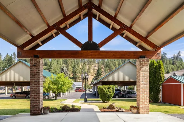 a view of swimming pool with a patio and a yard
