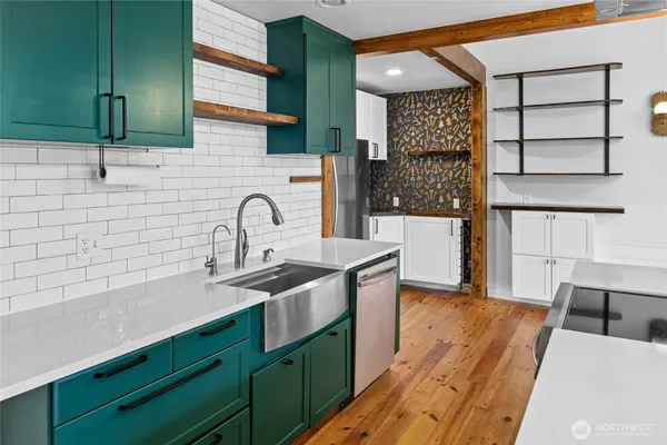 a kitchen with a sink and cabinets