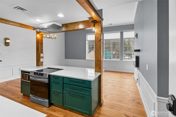 a kitchen with a stove and a refrigerator