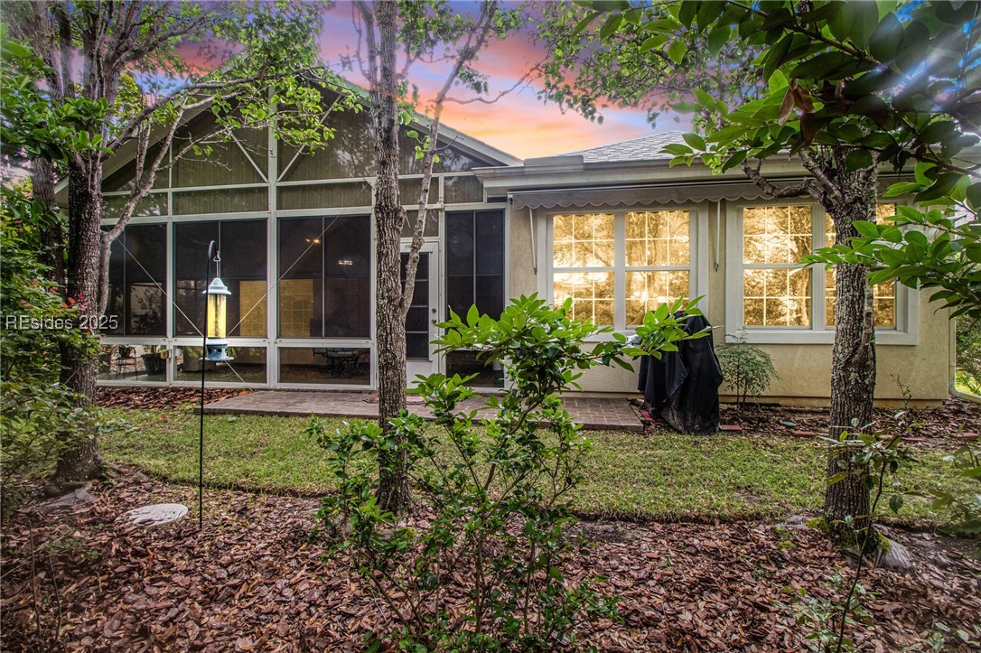 22 Sundome Court Bluffton, SC 29909 - Photo 2 of 30 Screened Lanai, vinyl windows, paver patio
