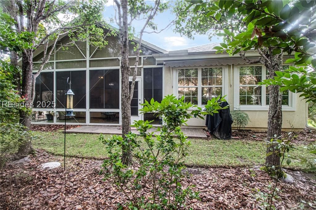 22 Sundome Court Bluffton, SC 29909 - Photo 28 of 35 Power awning with paver patio for grilling