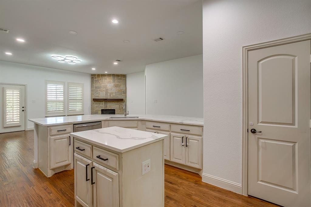3009 Montebello Drive Denton, TX 76210 - Photo 11 of 38 a kitchen with a stove a sink and a refrigerator