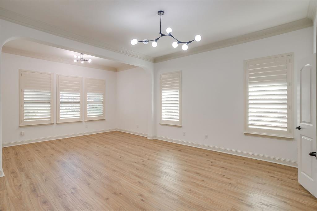 3009 Montebello Drive Denton, TX 76210 - Photo 15 of 38 a view of an empty room with wooden floor and a window