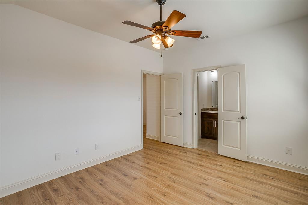3009 Montebello Drive Denton, TX 76210 - Photo 24 of 38 a view of an empty room with wooden floor