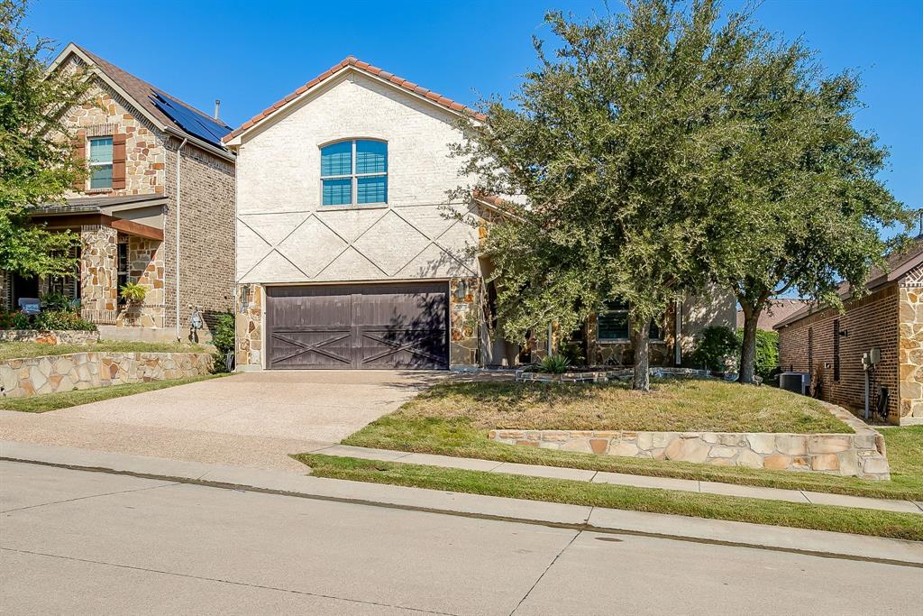 3009 Montebello Drive Denton, TX 76210 - Photo 3 of 38 a view of a house with a yard plants and large tree