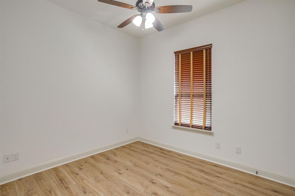 3009 Montebello Drive Denton, TX 76210 - Photo 32 of 38 wooden floor in an empty room with a window