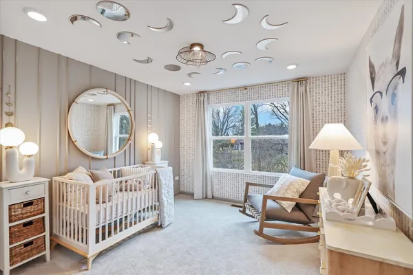 a bed room with furniture and a window