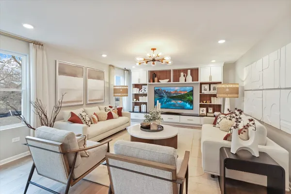 a living room with furniture and a wooden floor