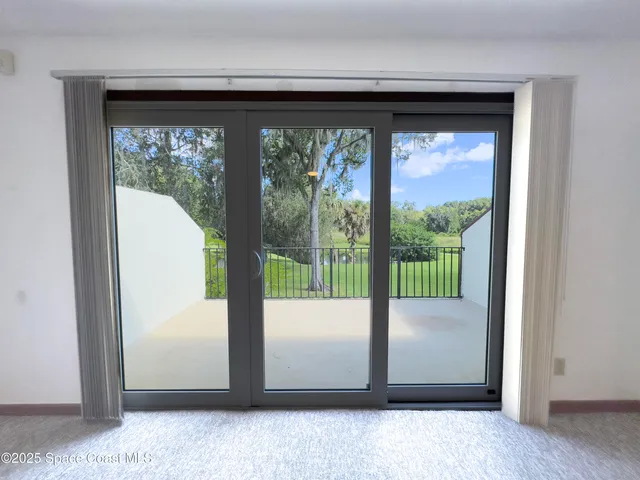 a view of a room that has a large window
