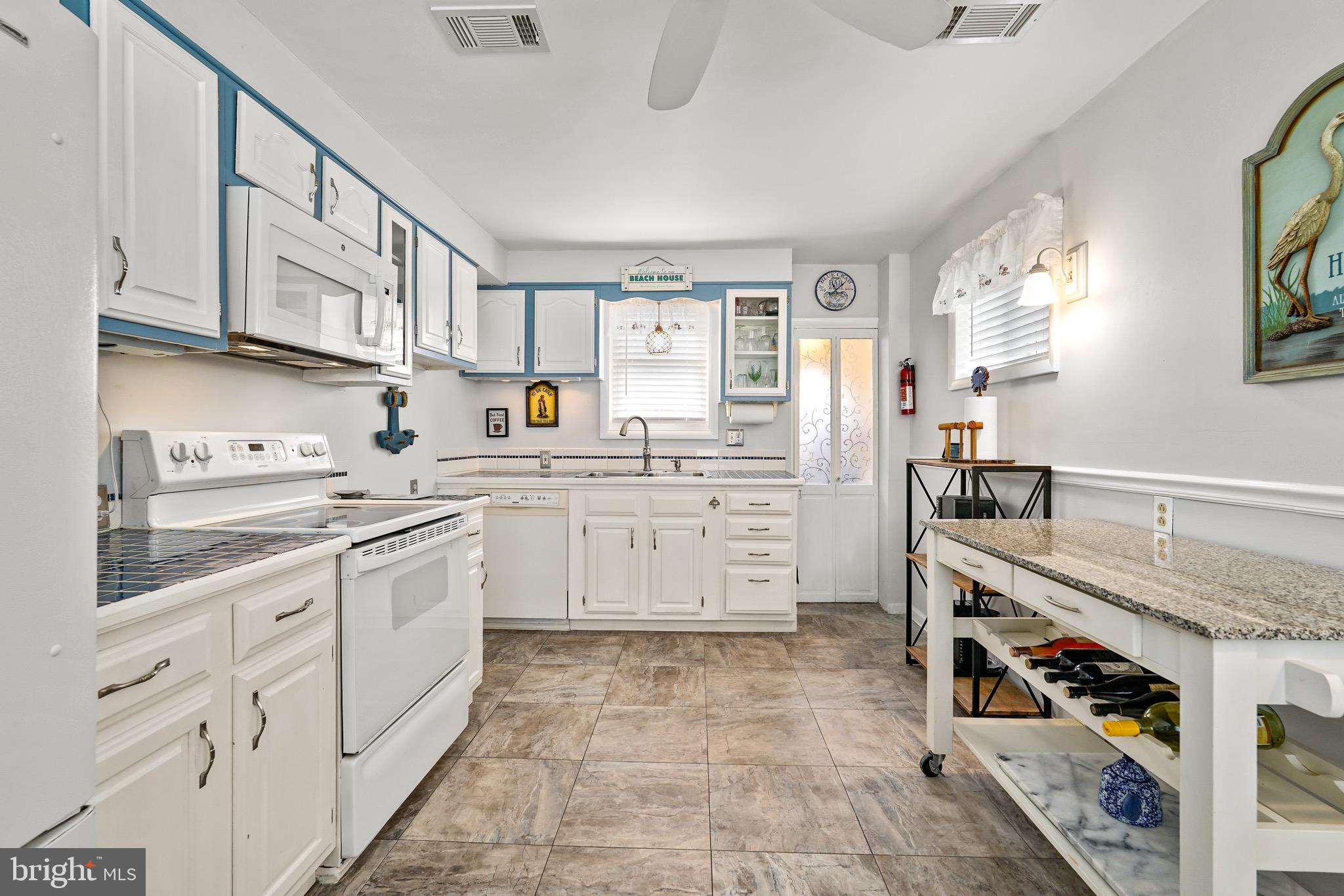 78 Riverview Avenue Earleville, MD 21919 - Photo 7 of 36 a kitchen with stainless steel appliances granite countertop a sink and cabinets
