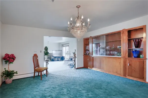 a large kitchen with a table and chairs