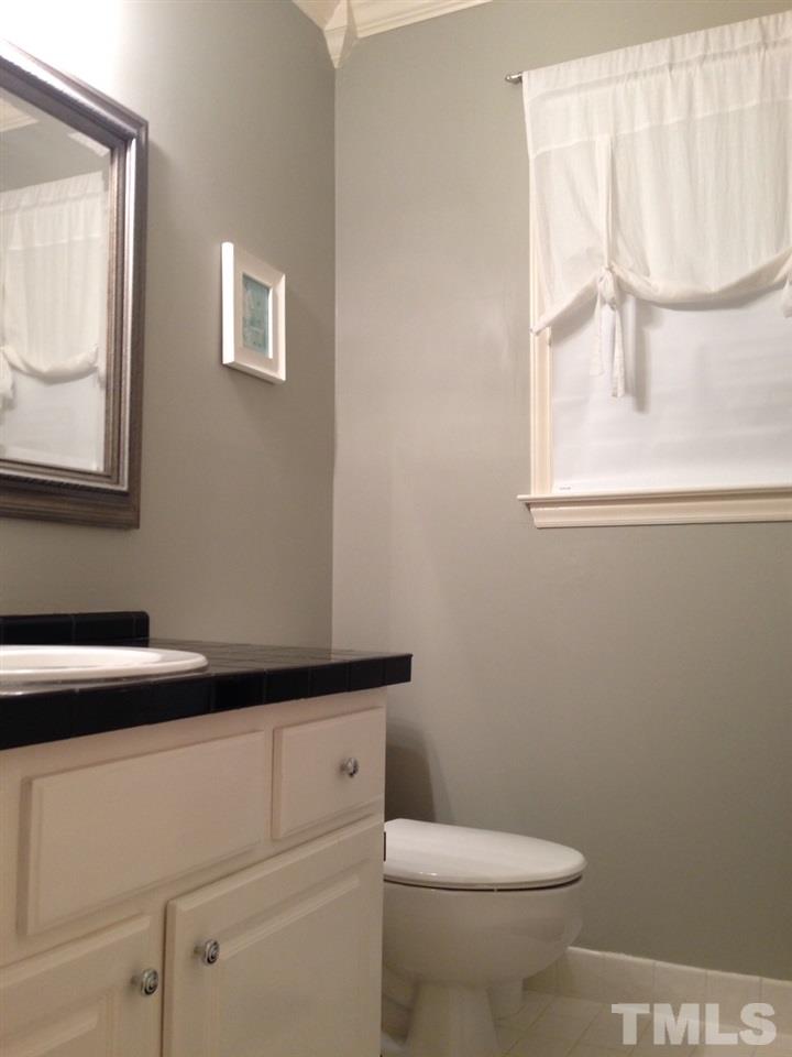 6809 Chasewick Circle Raleigh, NC 27615 - Photo 19 of 23 Also nicely updated, includes a tub and shower. White tile floor, and note the crown molding!