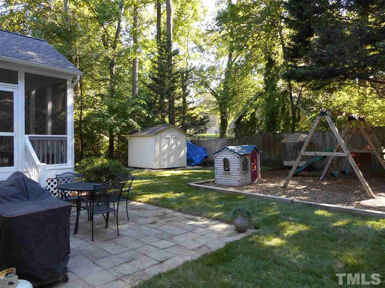 6809 Chasewick Circle Raleigh, NC 27615 - Photo 6 of 23 8x8 storage shed and playset in play area both convey
